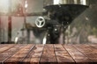 Empty wood table top and blurred coffee shop with coffee roaster interior background - can used for display or montage your products.