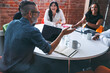 © Jacob Lund - Mature businessman leading a meeting in a modern workplace