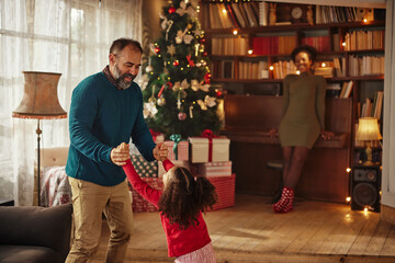 Cute family during Christmastime at home