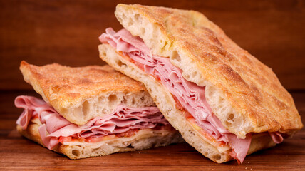 Sticker - Sandwiches with ham, tomato, and cheese on a wooden background