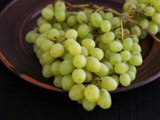 Wall Mural - Bunch of Sultana grapes on a plate