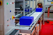 Warehouse automation. Automated conveyor lines with robotic manipulator