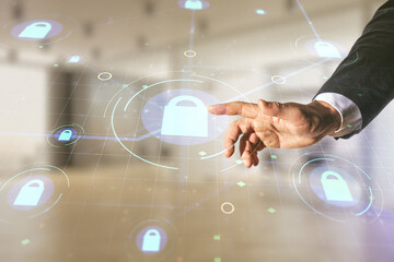 Poster - Double exposure of male hand presses on virtual creative lock hologram with chip on blurred office background. Information security concept