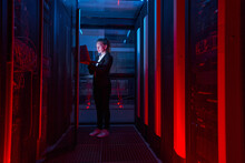 Woman Working On Servers In Data Center