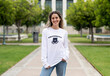 Girl wearing university jumper at campus, college apparel