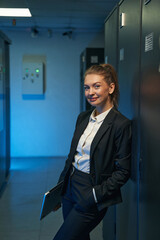 young engineer businesswoman in network server room