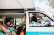 © Westend61 - Female friends having fun in camper van