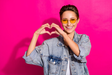 Sticker - Photo of young cheerful nice happy pretty woman make fingers heart shape isolated on pink color background