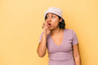 © Asier - Young latin woman isolated on yellow background being shocked because of something she has seen.