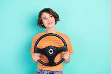 Sticker - Photo of dreamy adorable woman dressed striped t-shirt smiling driving car looking empty space isolated teal color background