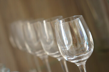 Wall Mural - Selective focus shot of a row of empty wine glasses