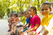 © oksix - The group of children are resting in the summer park