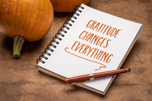 Gratitude Changes Everything - Inspirational Handwriting In A Notebook With Pumpkins, Thanksgiving Concept