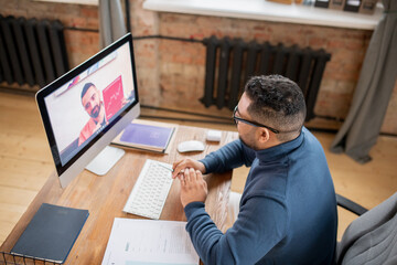 Aufkleber - Mature man looking at computer screen where confident teacher of economics explaining financial graph on paper