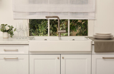 Poster - White sink with tap near window in kitchen. Interior design