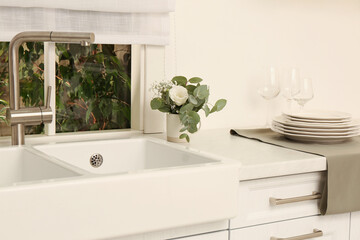 Sticker - White sink with tap near window in kitchen. Interior design