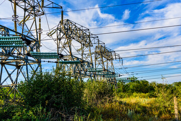 High voltage power line against the sky