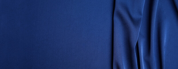 dark blue silk fabric as background, top view with space for text. banner design