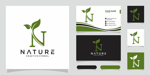 Letter N with leaf concepts with business card design.