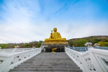 Wall Mural - View of Golden Buddha statue at Chon Khong Monastery in Vung tau city.