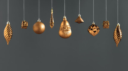 Poster - Christmas golden bauble decoration hanging on dark modern grey background.winter holiday greeting card