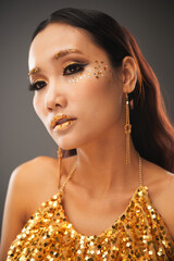 Sticker - Face of calm beautiful young woman in glitter top and black and golden eye make-up