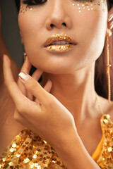 Sticker - Close-up image of young woman with full lips with golden lipstick and golden gliter stars as a part of Hallooween makeup