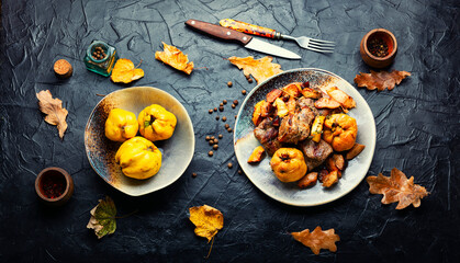 Wall Mural - Baked pieces of meat with quince