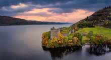Aerial View Of The Impressive Urquhart Castle At The Loch Ness During Autumn Sunset Time, Scotland
