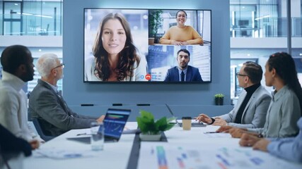 Wall Mural - Video Conference Call in Office Boardroom Meeting Room: Executive Directors Talk with Group of Multi-Ethnic Entrepreneurs, Managers, Investors. Businesspeople Discuss e-Commerce Investment Strategy