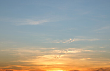 Heaven at early morning with copy space. Sunset, sunrise backdrop.Predawn clear sky with orange horizon and blue atmosphere. Smooth orange blue gradient of dawn sky.