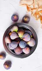 Wall Mural - Portion of fresh Figs on light background