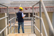 © Suriyo - Engineers take note of industrial plant inspections.