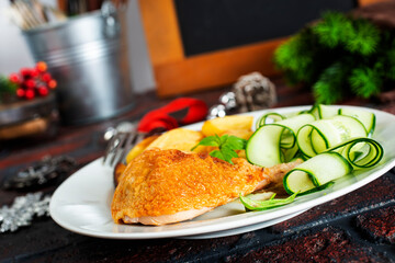 Wall Mural - Roast chicken on a plate. Christmas background