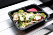 Takeaway, green salad with camembert cheese
Appetizing ready-to-go dish served in a disposable box. Culinary photography. Food background.