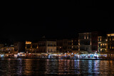 Fototapeta Mapy - Old port of Chania by night, with crowd on the pier