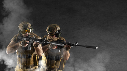 Wall Mural - During a special operation, soldiers of the professional special forces are shrouded in smoke against the background of a dark concrete wall. They aiming in enemy. Photo format 16x9.