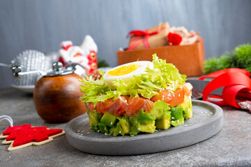 Wall Mural - salmon and avocado and cucumber. salad on plate