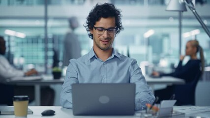 Poster - Modern Office Businessman Working on Computer, Smiling, Looking at Camera. Portrait of Successful Latin IT Software Engineer Working on a Laptop at his Desk. Front View Static Shot