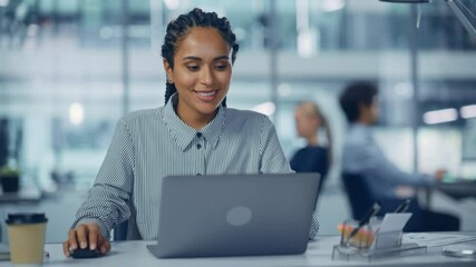 Poster - Multi-Ethnic Office: Professional Black Female IT Engineer Working on Desktop on Laptop Computer. Successful, Smiling Businesswoman with Braided Hair Does Creative Job. Confident Product Designer