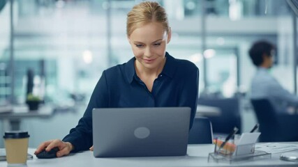 Wall Mural - Modern Office: Portrait of Successful Young Adult Businesswoman Working on a Laptop at his Desk. Smiling Confident Digital Entrepreneur. Beautiful Professional Specialist. Medium Front View Arc Shot