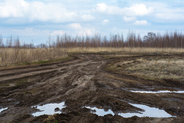 Bad country road. A dirt road damaged. Clay, dirt. Concept problem with the roads. human impact on the environment. Russian bad road