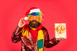 © be free - this perfect one. ready for party celebration. hipster enjoy the holiday. morning before Xmas. bearded man in party glasses. new year shopping idea concept. man in santa hat await christmas present