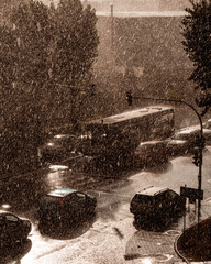 Sticker - Vertical shot of cars and a bus in the rainy street