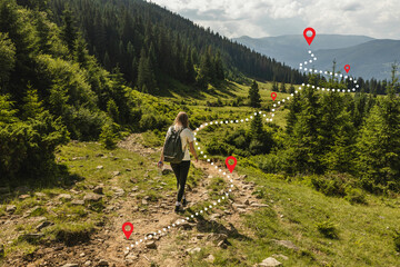 woman traveler explorer with backpack hiking to the top of the mountain. adventure weekend.