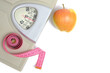 © freeman83 - Scales with measuring tape and apple, symbol and concept weight loss, sports and fitness.