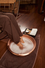 Wall Mural - Client having foot bath in wellness center