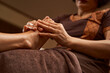 © Viacheslav Yakobchuk - Practitioner massaging client lower extremity using both hands