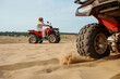 © Nomad_Soul - View on atv wheel, man in helmet on background