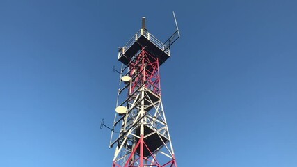 Poster - red radio beacon against blue sky. High quality FullHD footage